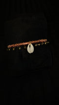 Chunky bangle with bells and cowrie shell